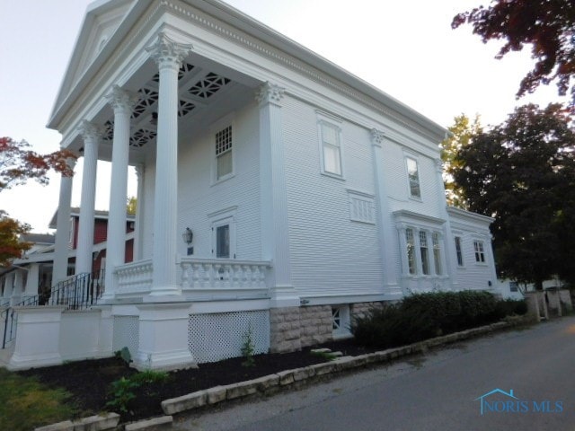 view of home's exterior featuring covered porch