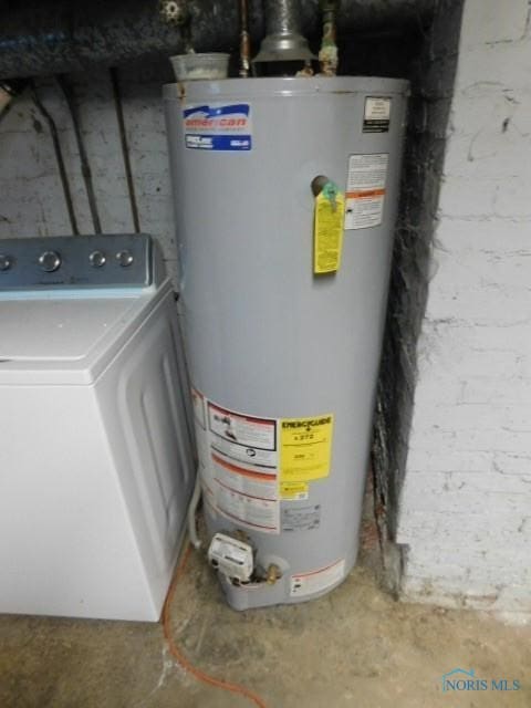 utilities featuring washer / clothes dryer and gas water heater