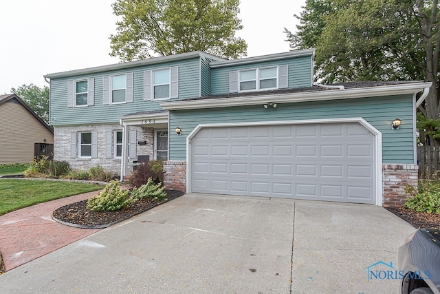 view of front property with a garage and a front lawn