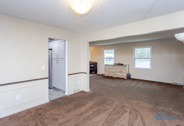 interior space featuring a textured ceiling