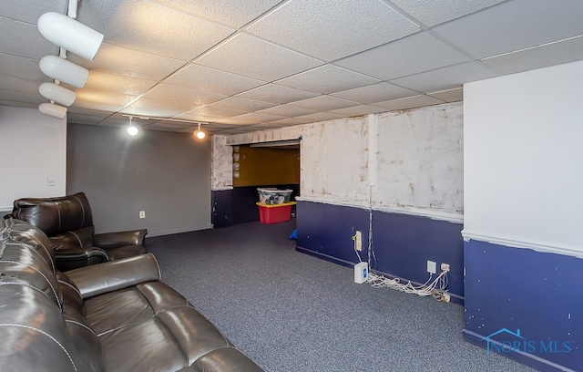 home theater with a drop ceiling, carpet, and track lighting