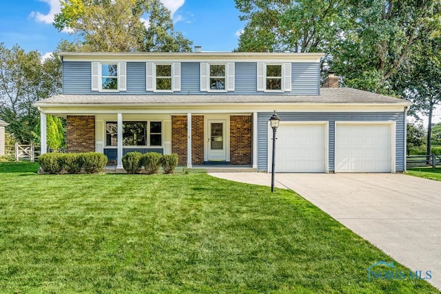 view of property with a porch, a front yard, and a garage