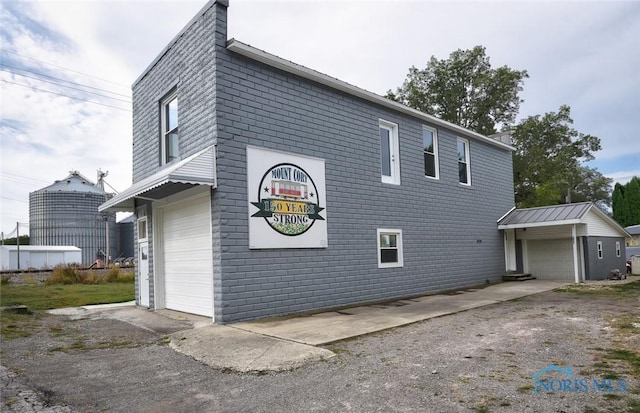 view of property exterior featuring a garage