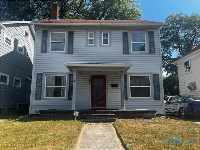 view of front of house with a front lawn