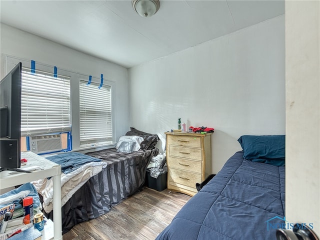 bedroom featuring wood-type flooring