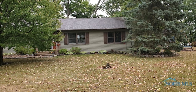 ranch-style house with a front yard