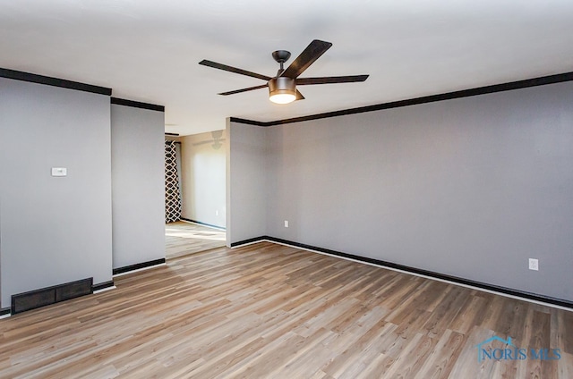 unfurnished room with crown molding, ceiling fan, and light hardwood / wood-style flooring