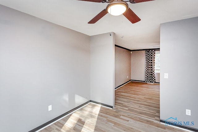 unfurnished room featuring light wood-type flooring and ceiling fan