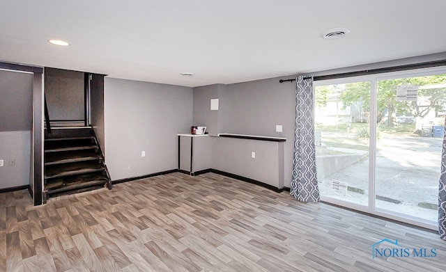 basement featuring light hardwood / wood-style floors