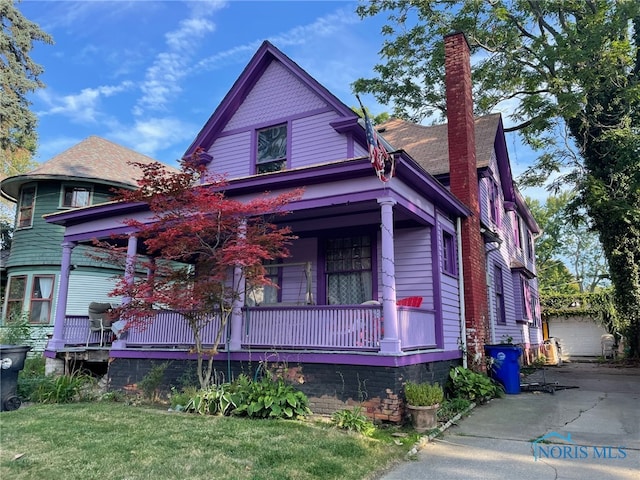630 Acklin Ave, Toledo, OH 43620 - victorian-style house featuring a porch and a front yard