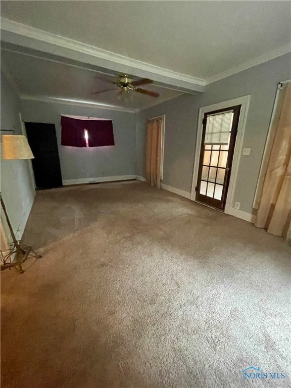 unfurnished living room featuring ceiling fan, beam ceiling, carpet, and ornamental molding