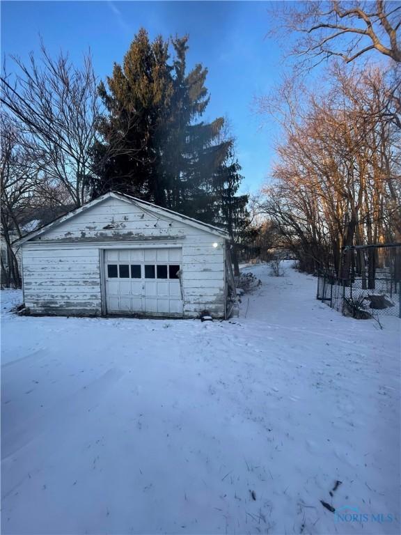 view of snow covered garage