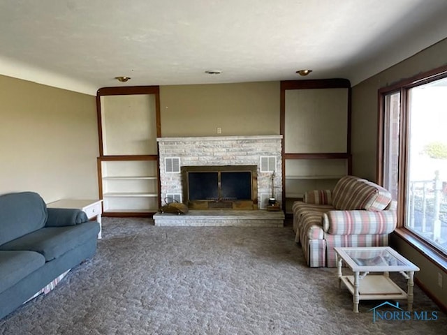 unfurnished living room featuring a fireplace, a wealth of natural light, and dark colored carpet