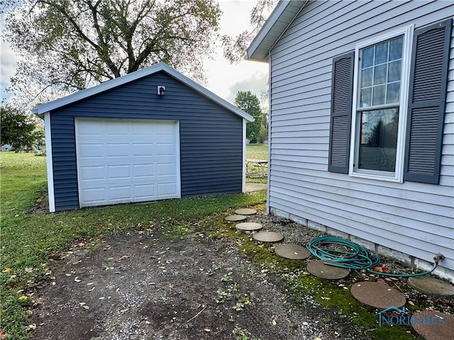 garage featuring wood walls