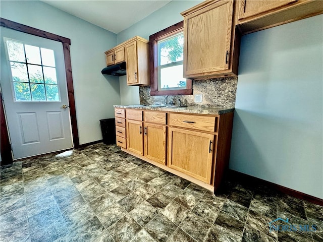 kitchen with backsplash and sink