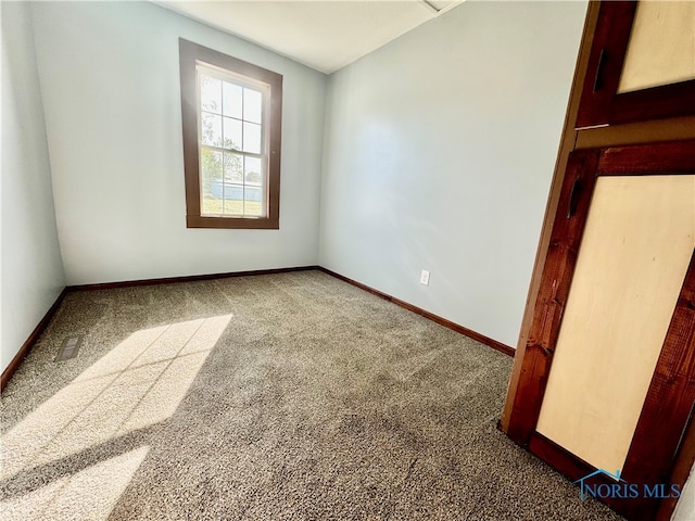 view of carpeted spare room