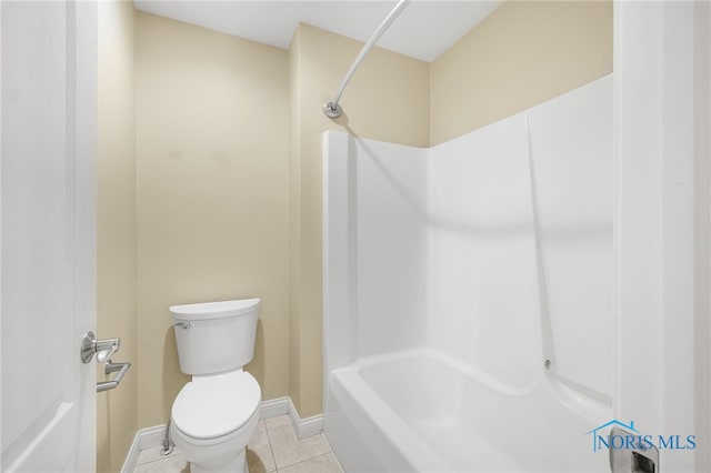 bathroom with shower / bath combination, tile patterned floors, and toilet