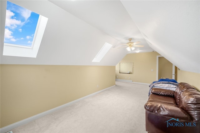 additional living space with ceiling fan, lofted ceiling, and carpet