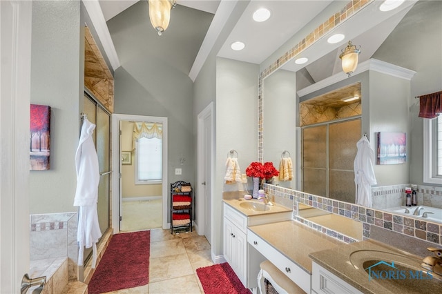 bathroom featuring ornamental molding, tile patterned floors, independent shower and bath, and vanity