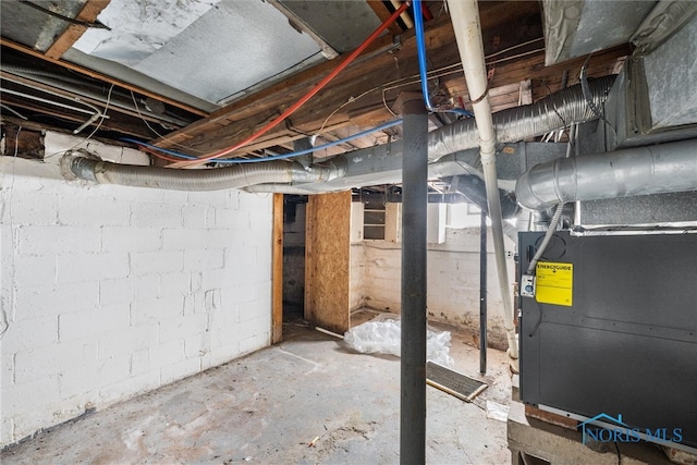 basement featuring heating unit