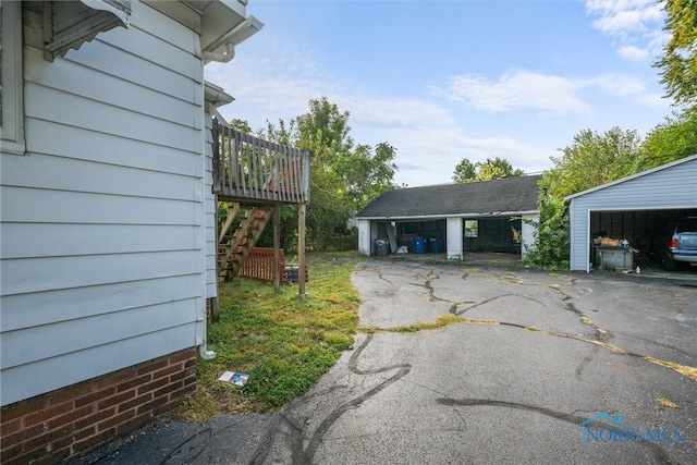 exterior space featuring an outdoor structure and a carport