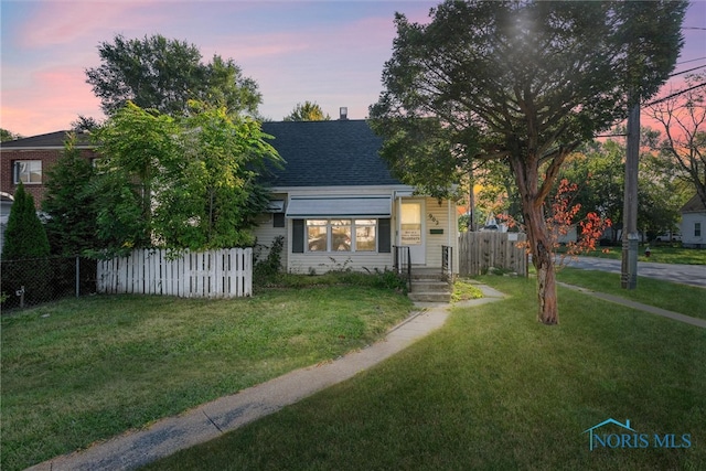 view of front of house with a lawn