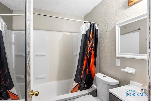 full bathroom featuring shower / bath combo, a textured ceiling, vanity, and toilet