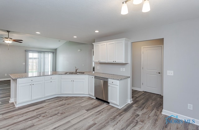 kitchen featuring white cabinets, kitchen peninsula, dishwasher, light wood-type flooring, and sink