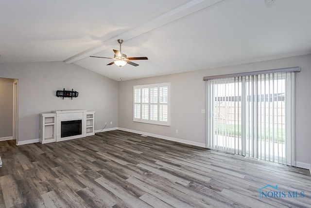 unfurnished living room with vaulted ceiling with beams, ceiling fan, and dark wood-type flooring