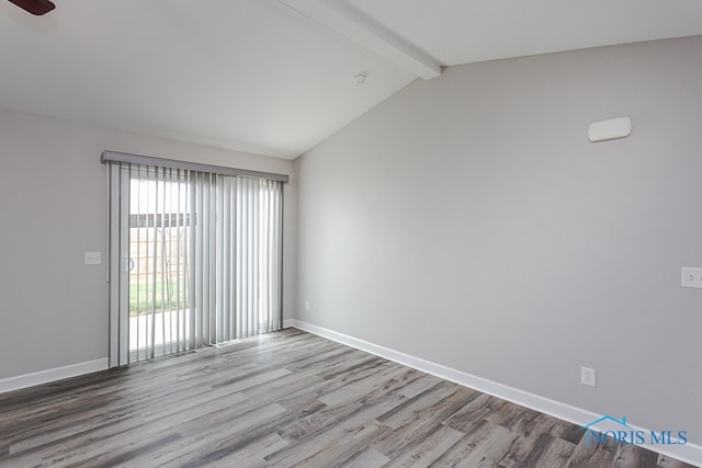 empty room with lofted ceiling with beams, wood-type flooring, and ceiling fan