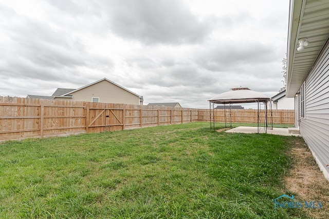 view of yard featuring a gazebo and a patio area