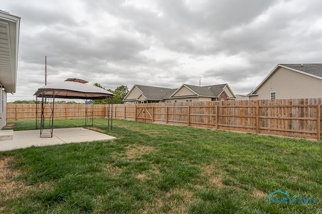 view of yard featuring a patio and a gazebo