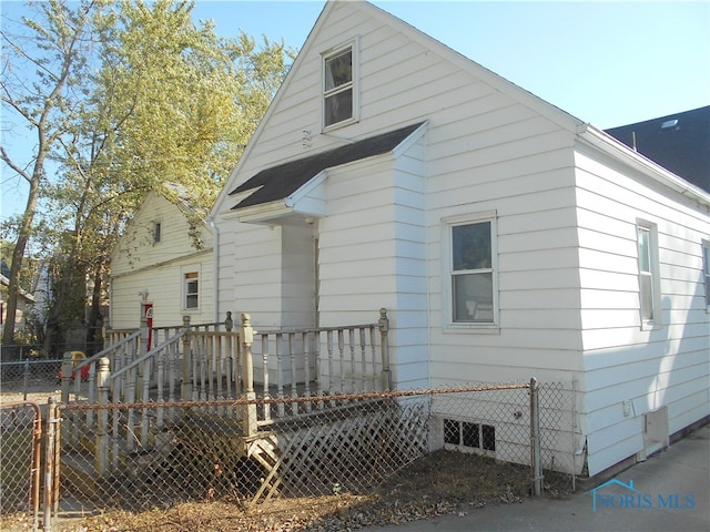 view of side of home with a deck