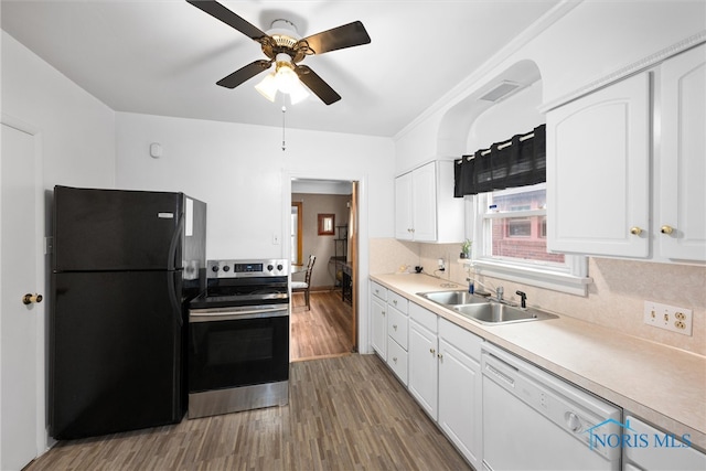 kitchen with ceiling fan, white dishwasher, hardwood / wood-style flooring, stainless steel electric range oven, and black refrigerator