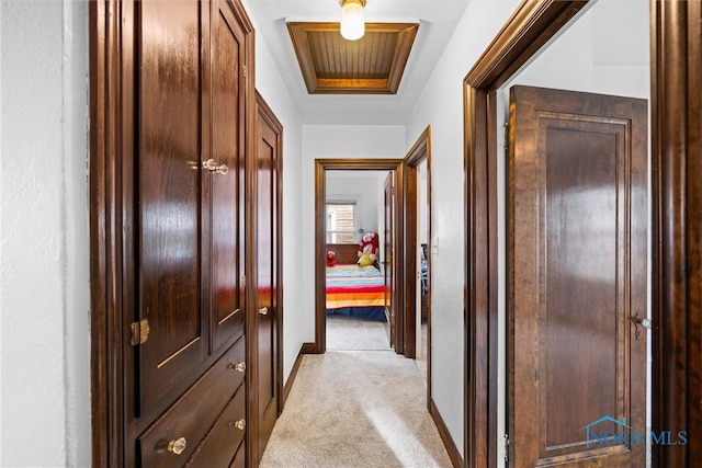 hallway featuring light carpet