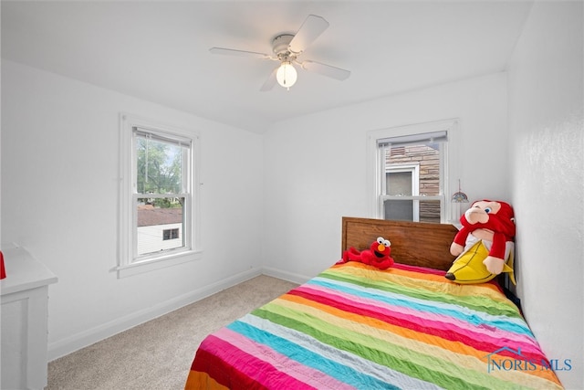 bedroom with light carpet and ceiling fan