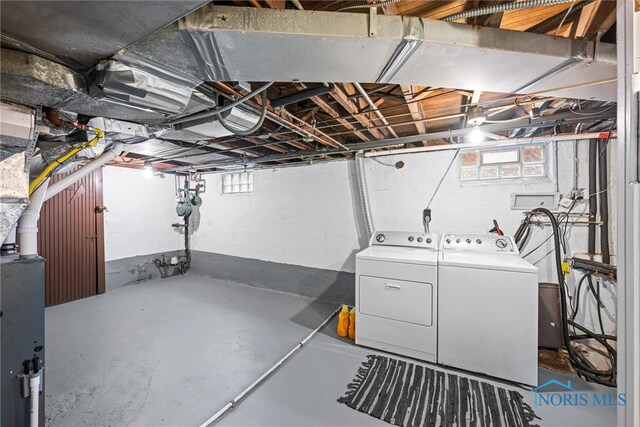 basement with washing machine and dryer