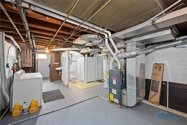 basement featuring separate washer and dryer and gas water heater