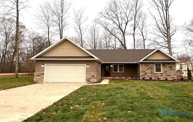 view of front of house featuring a garage and a front yard