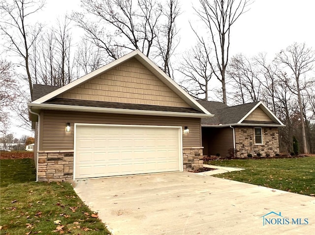 craftsman-style home featuring a garage and a front yard