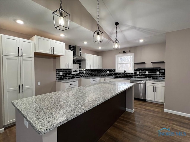 kitchen with white cabinetry, light stone countertops, dishwasher, and pendant lighting