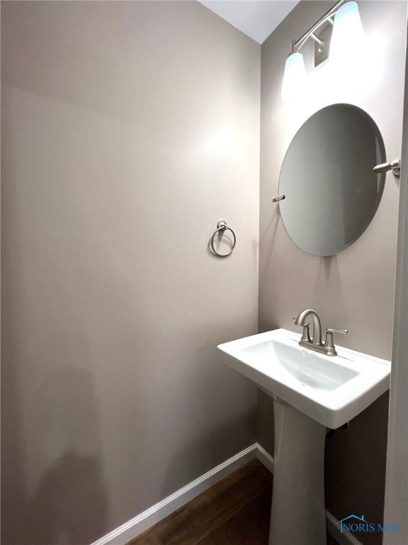 bathroom with hardwood / wood-style floors