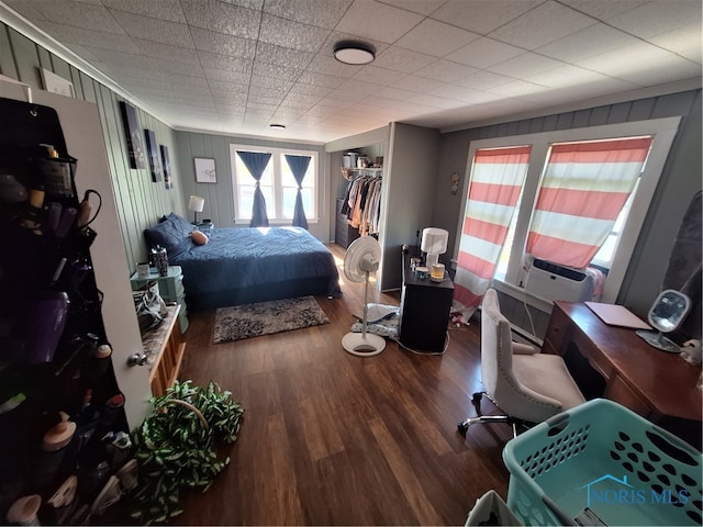 bedroom featuring a closet and dark wood-type flooring