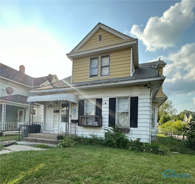 view of front of home featuring a front lawn and a porch