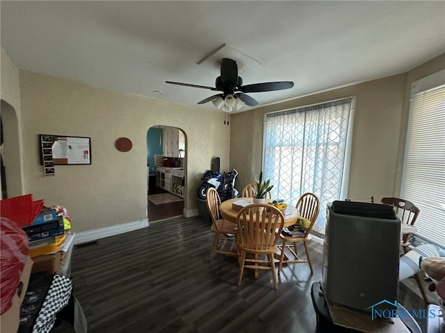 dining area featuring dark hardwood / wood-style flooring and ceiling fan