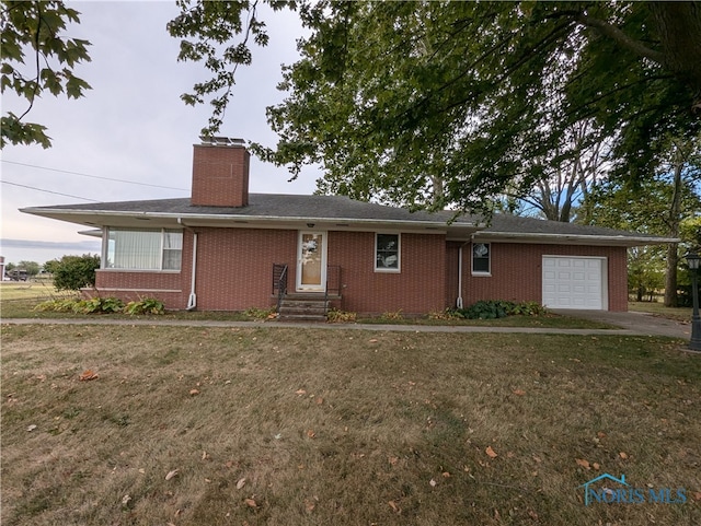 single story home with a front lawn and a garage