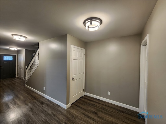 spare room with dark hardwood / wood-style flooring