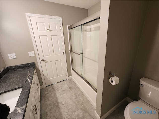 full bathroom featuring shower / bath combination with glass door, vanity, and toilet