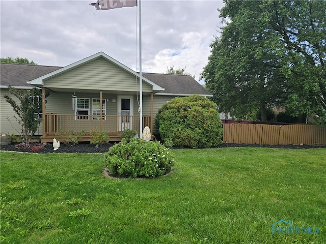 back of property featuring a yard