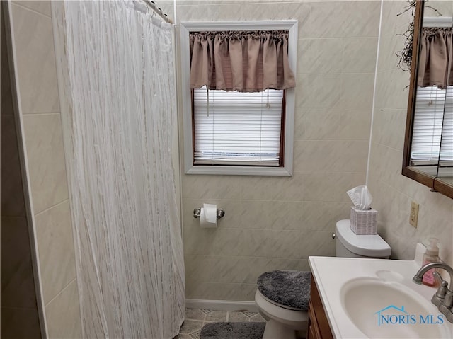 bathroom featuring vanity, tile walls, toilet, and a shower with shower curtain